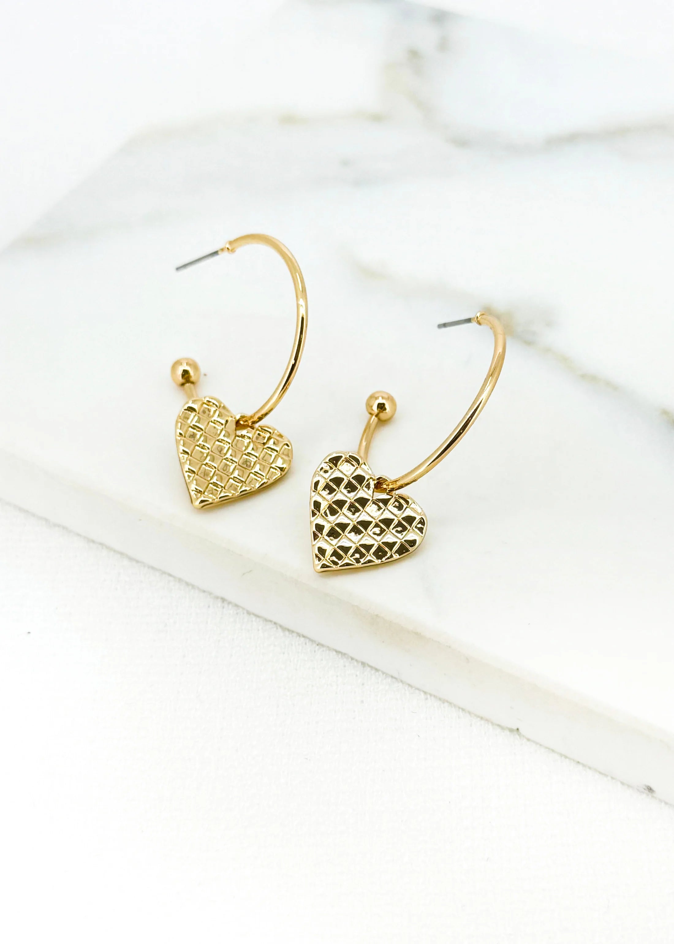 Gold hoop with textured heart charm earring
