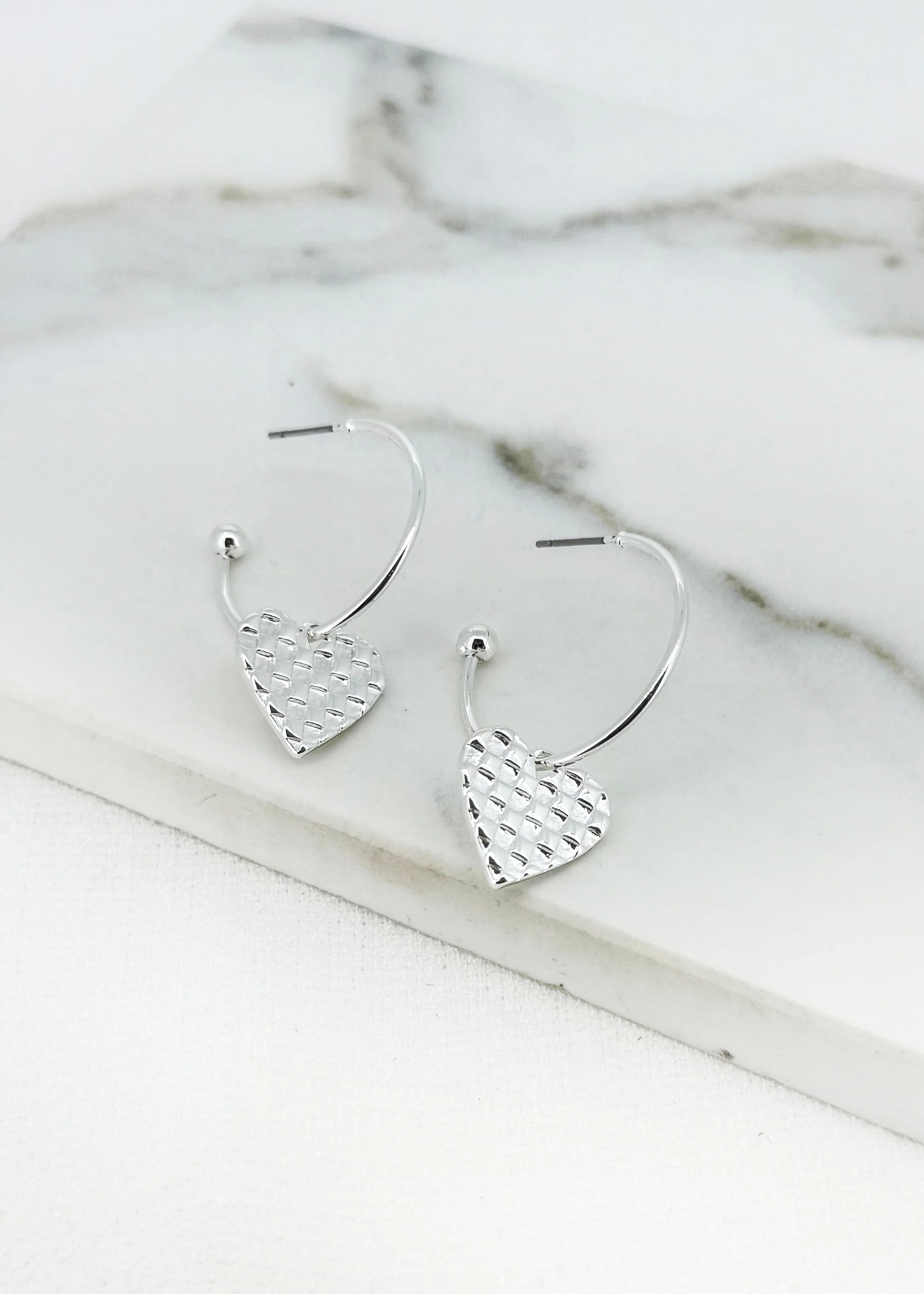 Silver hoop with textured hart charm earring
