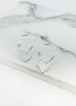 Silver hoop with textured hart charm earring