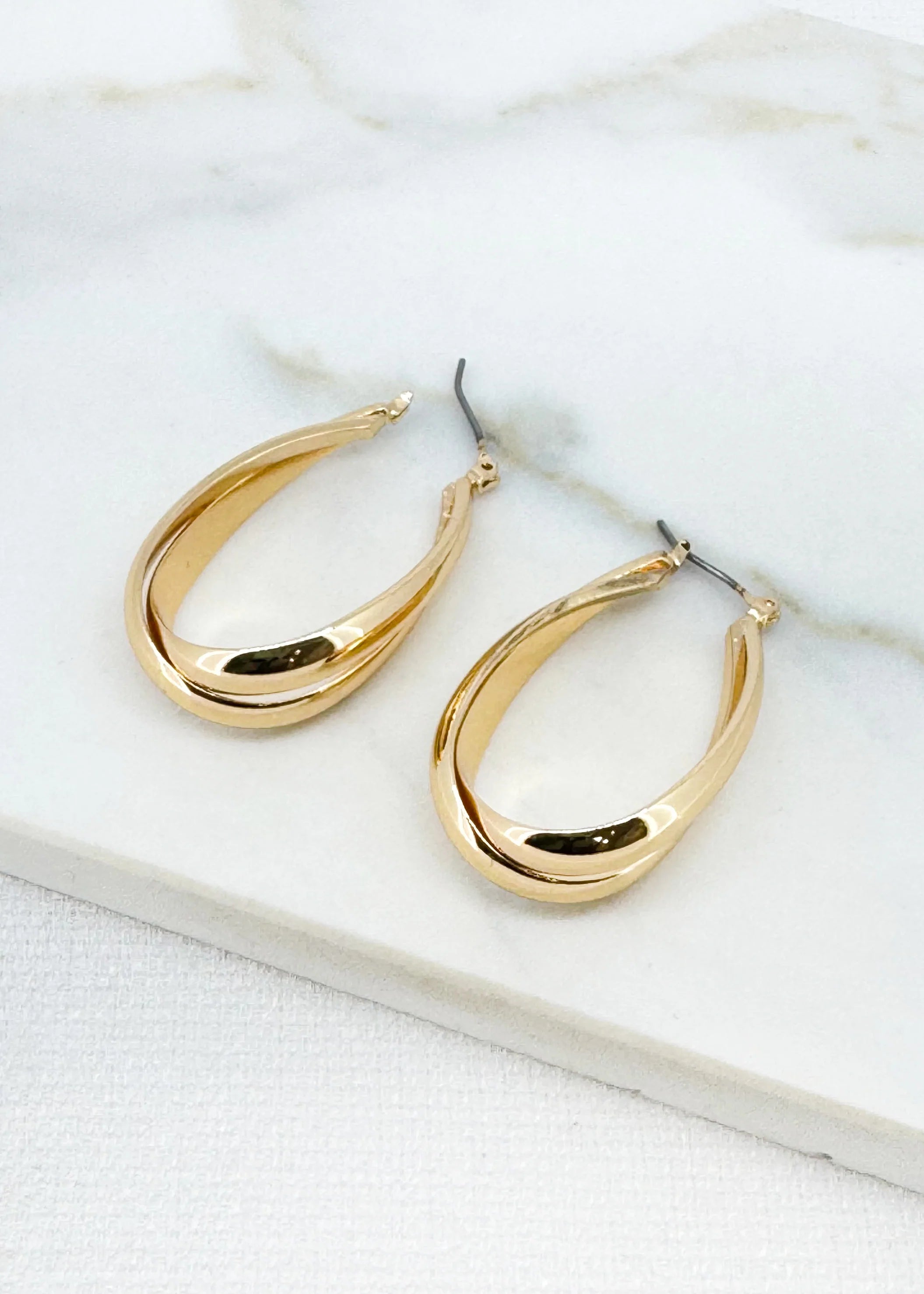Large gold cross over hoop earring