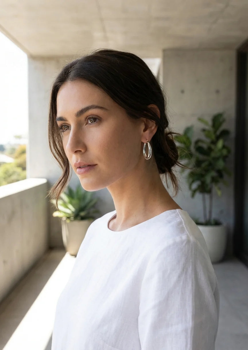 Large silver cross over hoop earring
