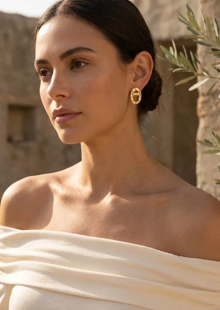 Gold oval earring