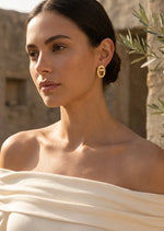 Gold oval earring