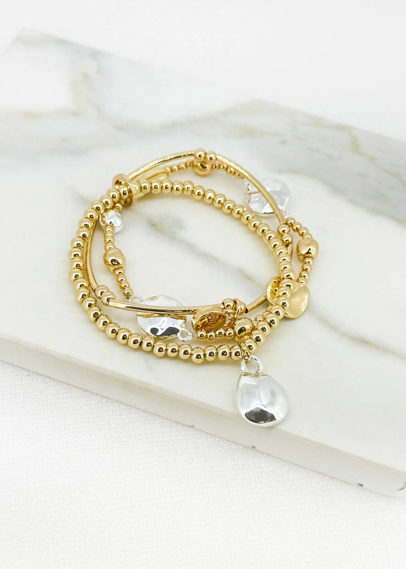 Gold triple layer bracelet with silver bead design