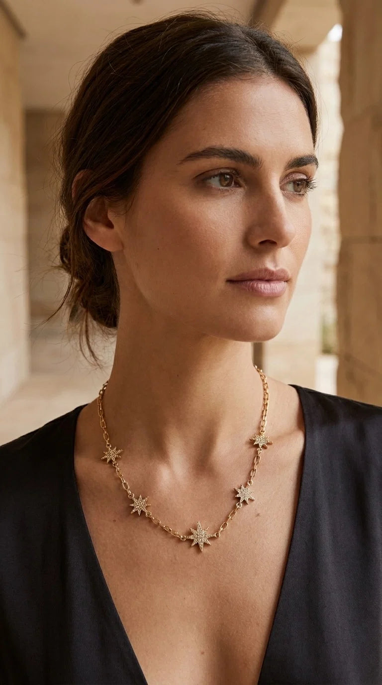 Short gold necklace with diamante star detail