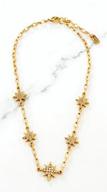 Short gold necklace with diamante star detail